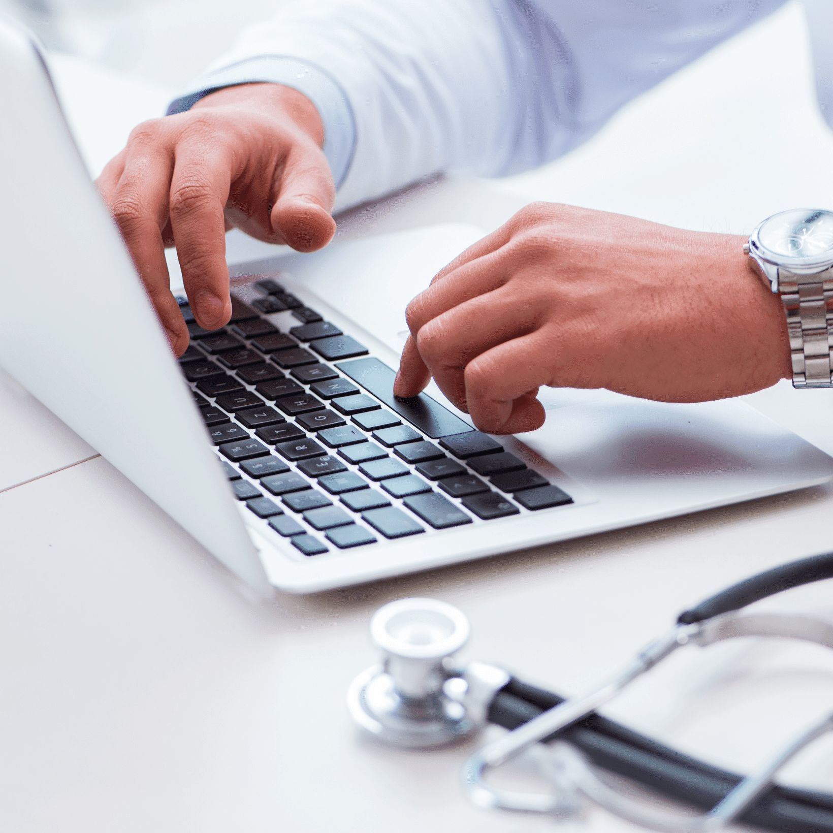 Doctor viewing electronic charts for his patients